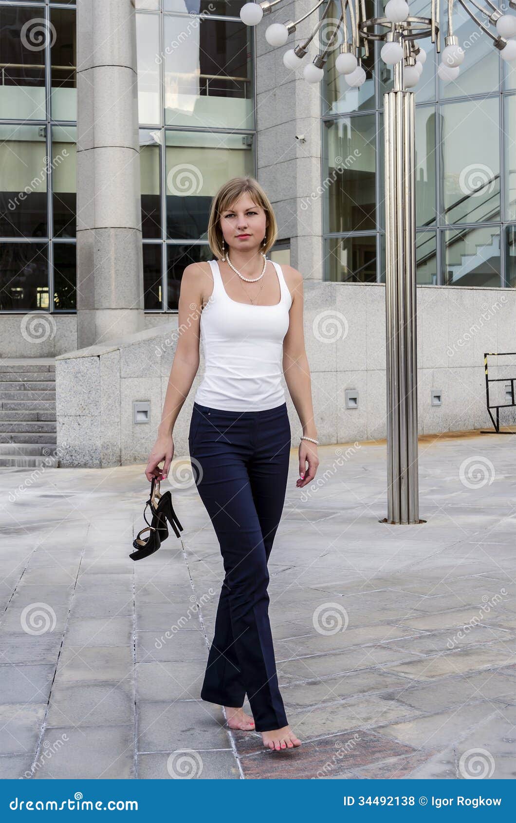 https://thumbs.dreamstime.com/z/young-woman-walking-businessman-hard-day-background-business-center-modern-34492138.jpg?ct=jpeg