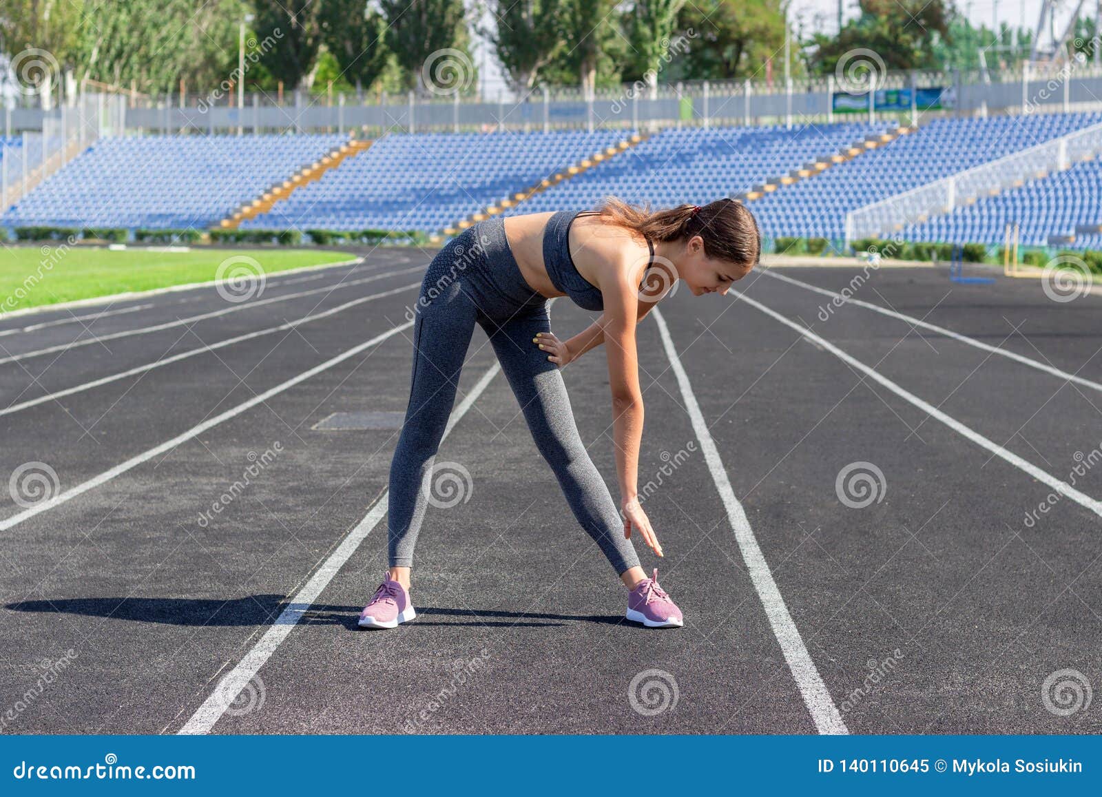 Young Woman Warms Up before Jogging on Stadium, People Sport and ...