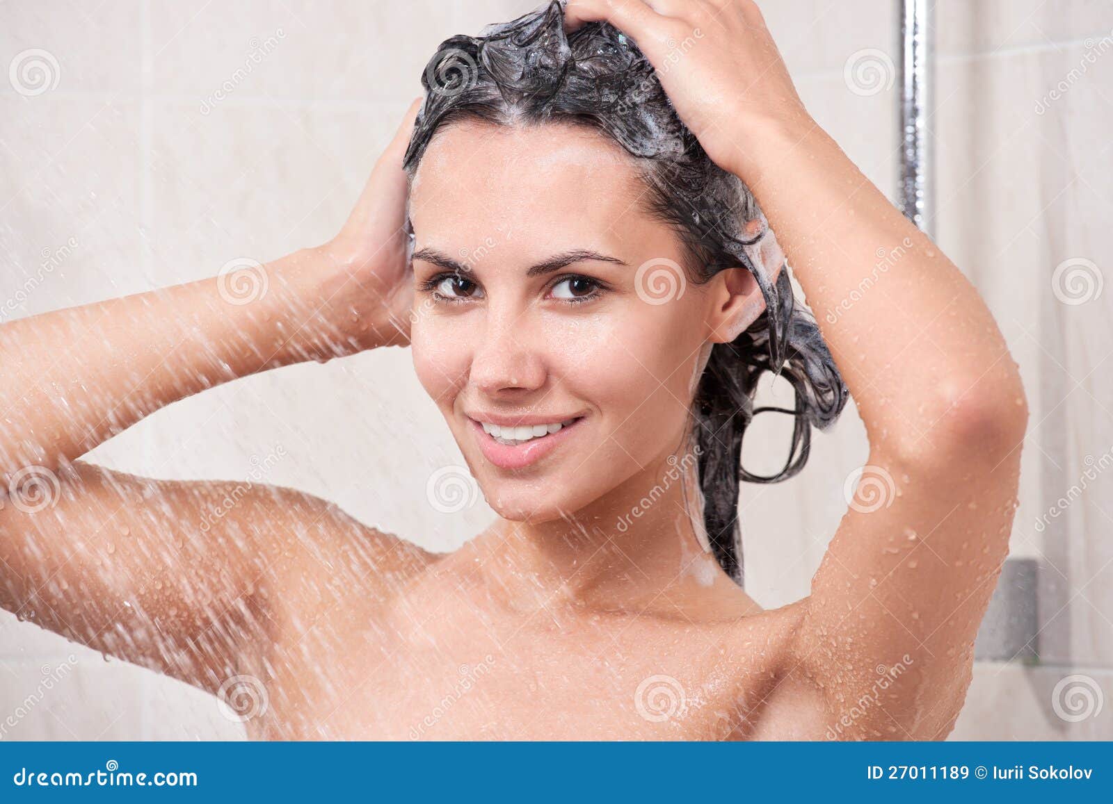 young woman washing head by shampoo