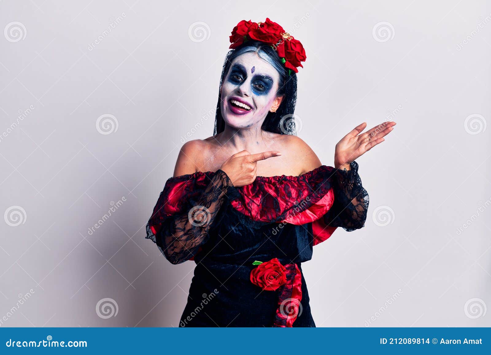 Young Woman Wearing Mexican Day of the Dead Makeup Amazed and Smiling ...