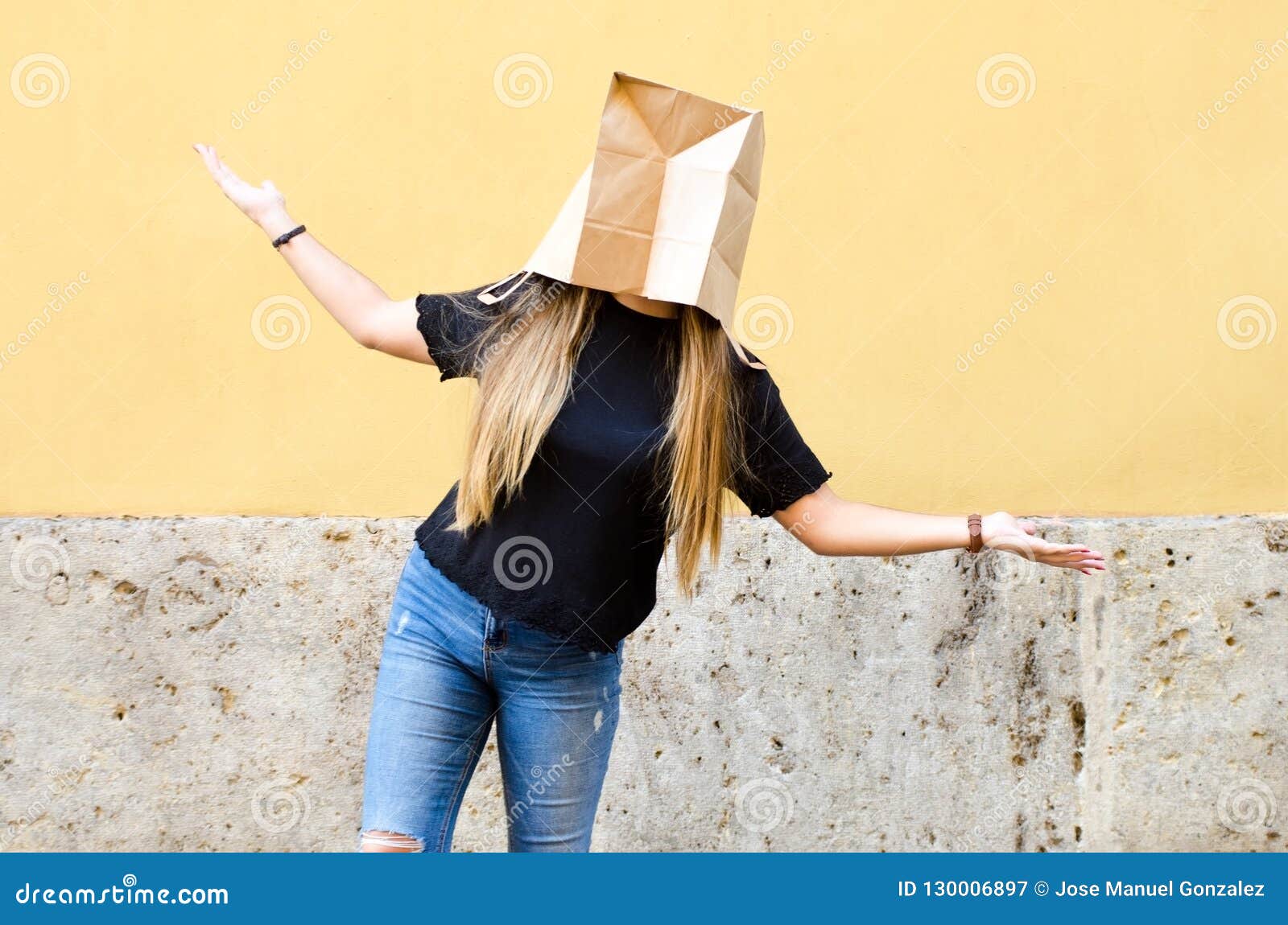 Download Young Woman Wearing A Paper Bag Over Her Head In Front Of Yellow Stock Image Image Of Blonde Front 130006897 Yellowimages Mockups