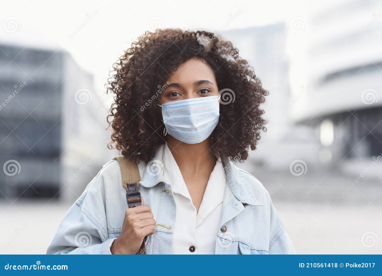 Young Woman Wearing Protective Face Mask in a City. Masked African ...