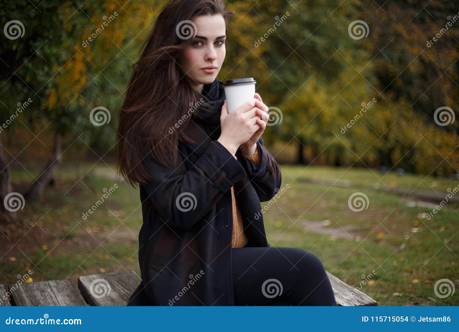 Young Woman Wearing Stylish Checkered Coat Sitting in the Autum Stock ...