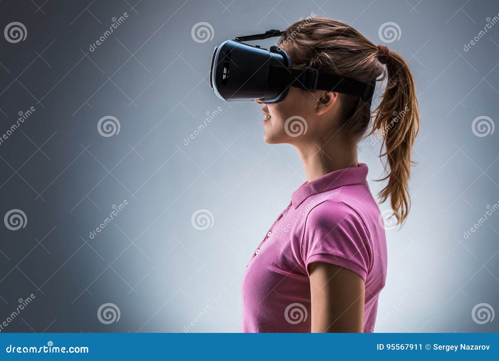 Young Woman Using Cardboard Virtual Reality Headset Stock 