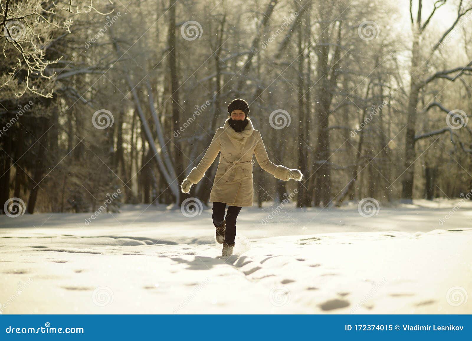 Portrait of Young Woman in White Coat Hat Walking in Sunny Snowy Forest ...