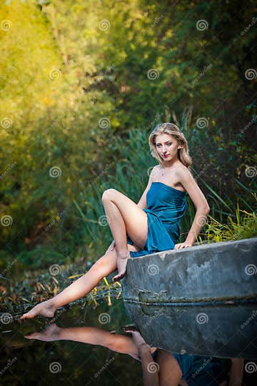 Young Women in a Blue Long Dress at Sunset in a Forest Stock Photo ...