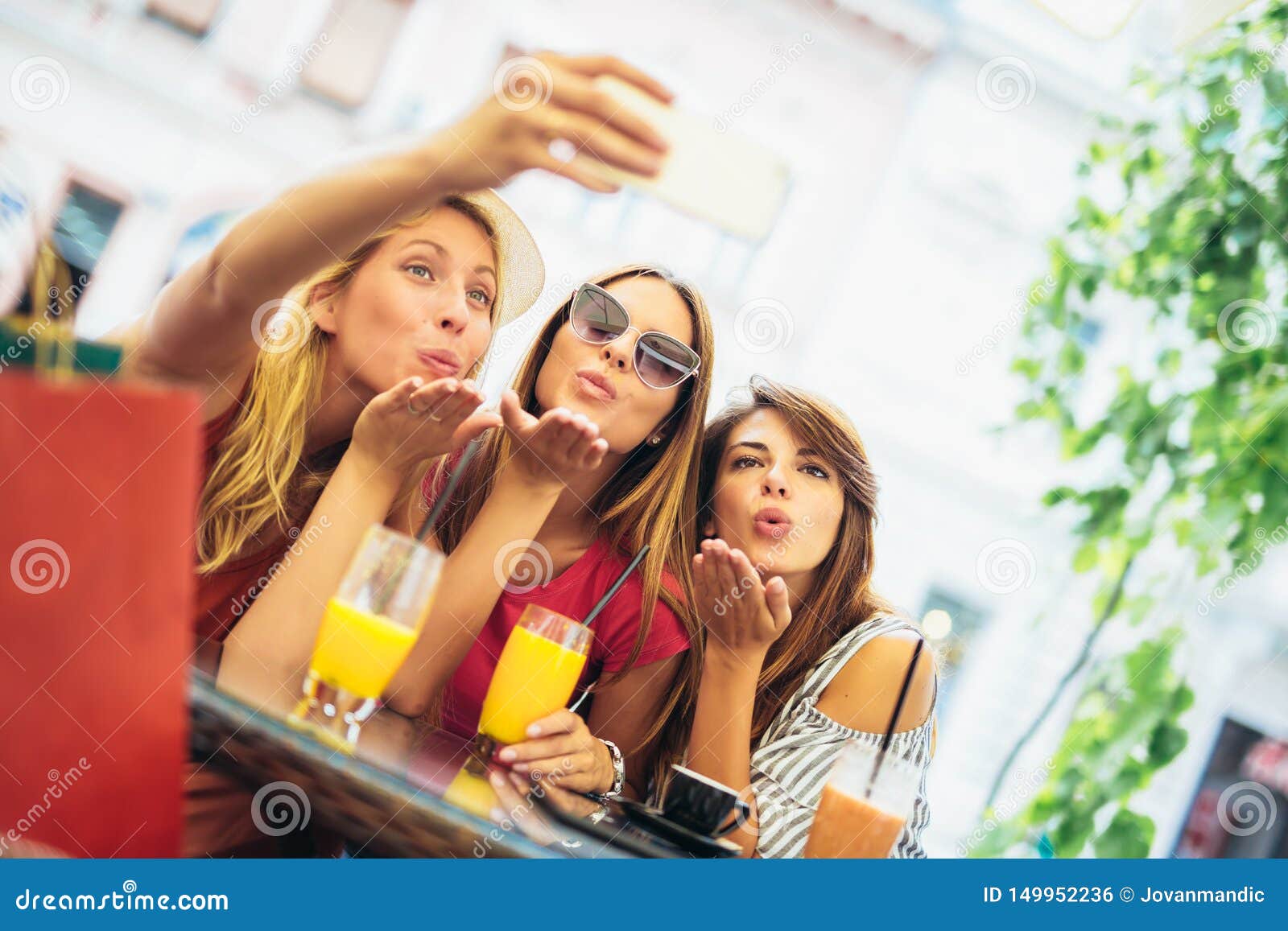 Young Women in a Cafe after a Shopping Make Selfie Photo Stock Photo ...