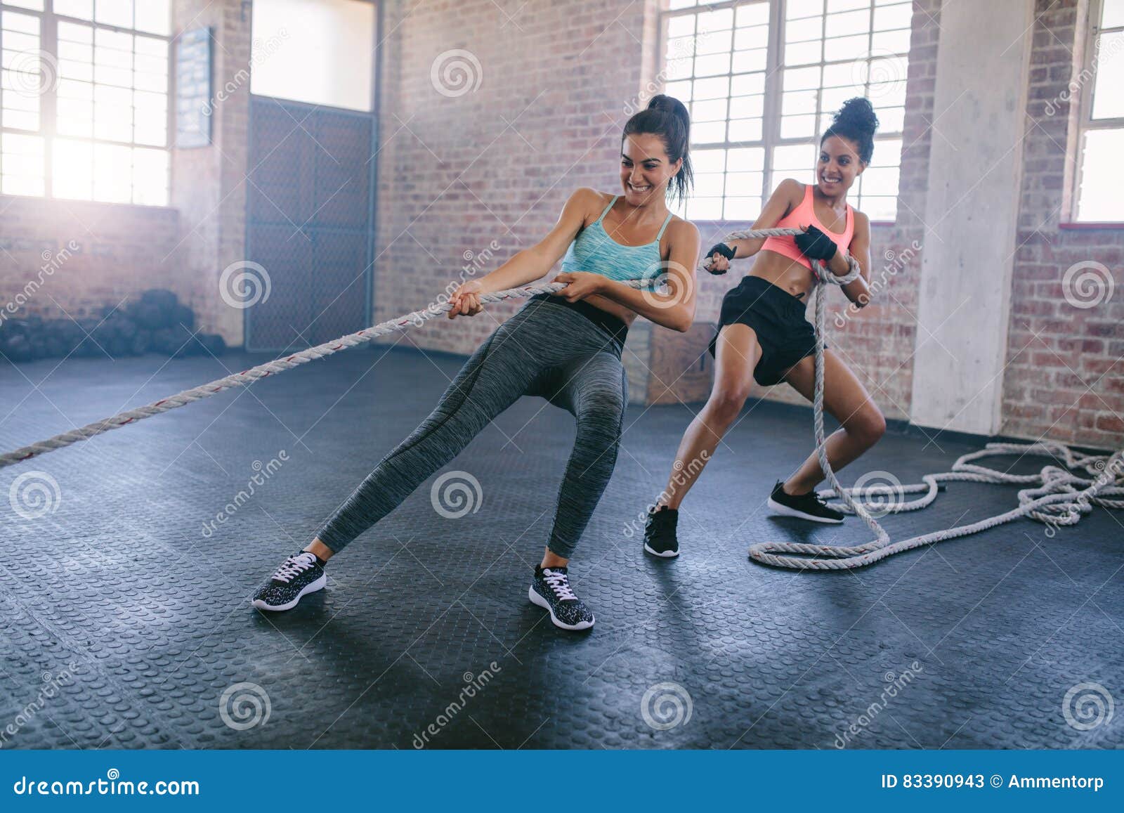 Young Women Doing Rope Pulling Exercises at a Gym Stock Image