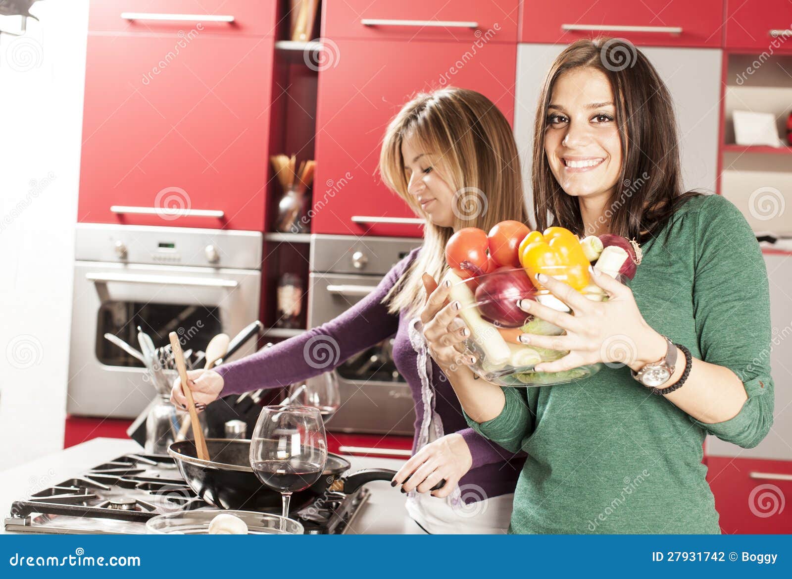 Young women in the kitchen stock photo. Image of modern 27931742