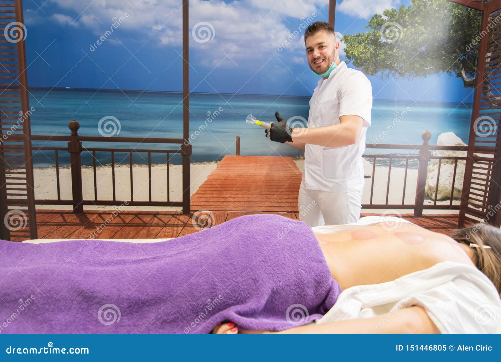 Young Woman Laying Down At The Massage Table And Doing Hijama Treatment