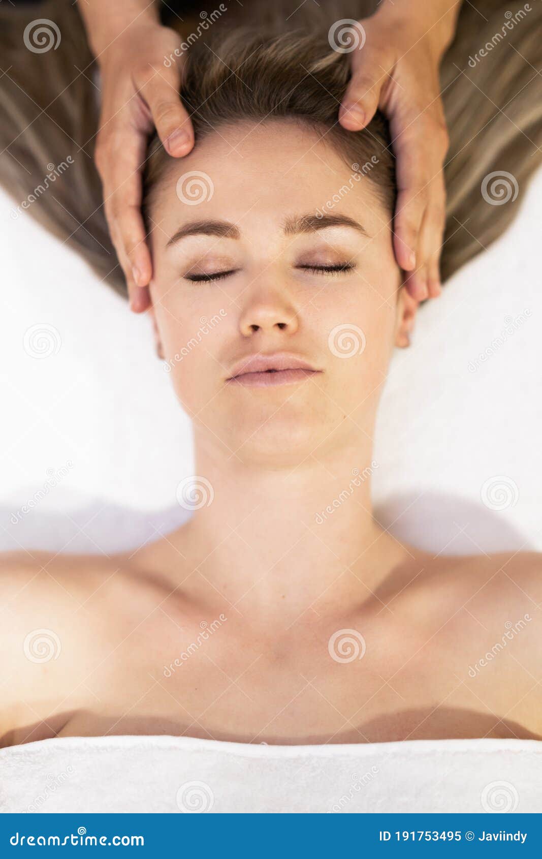 Young Blond Woman Receiving A Head Massage In A Spa Center Stock Image