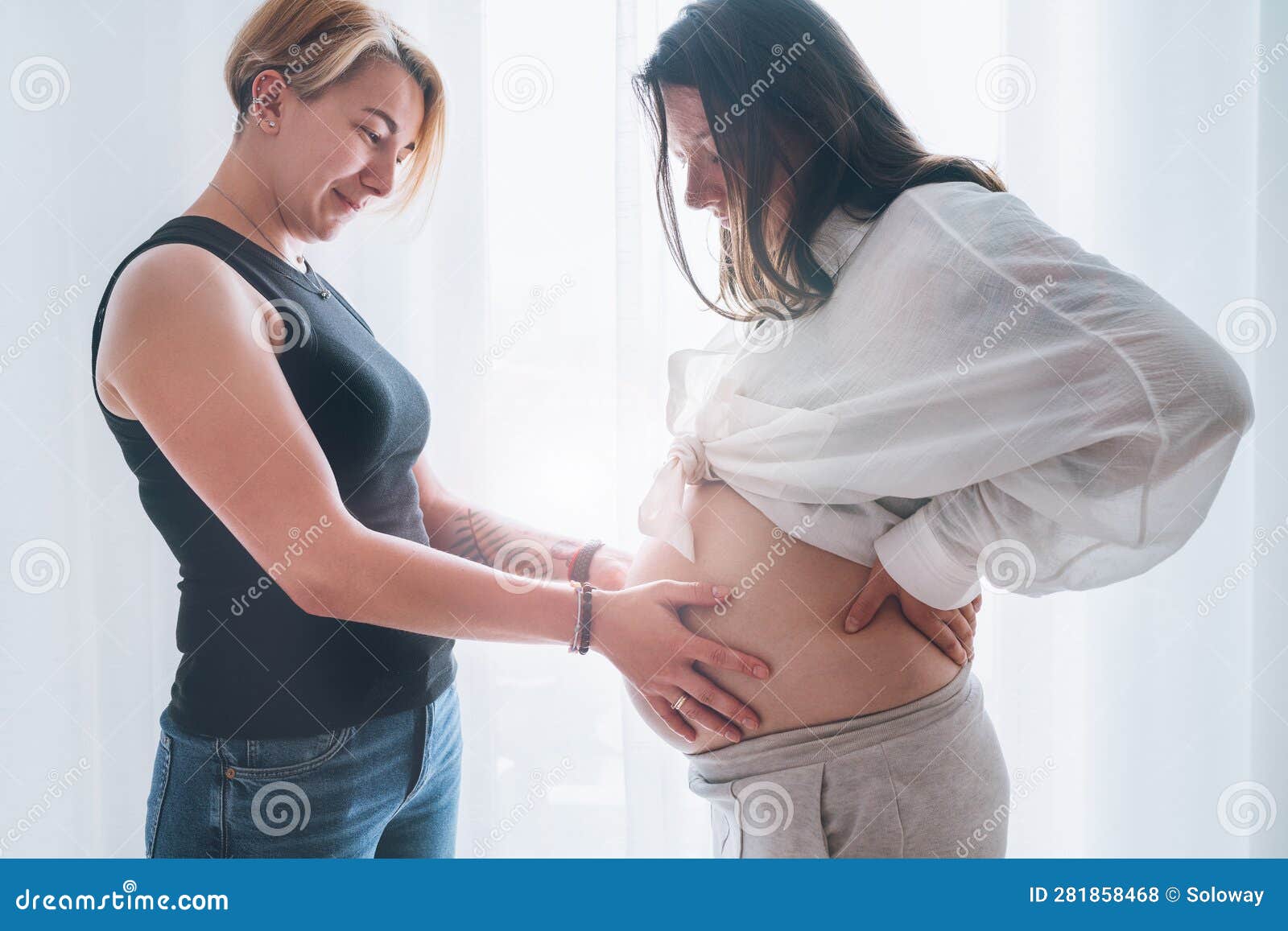 Young Woman Tender Touching Partner S Female Pregnant Belly