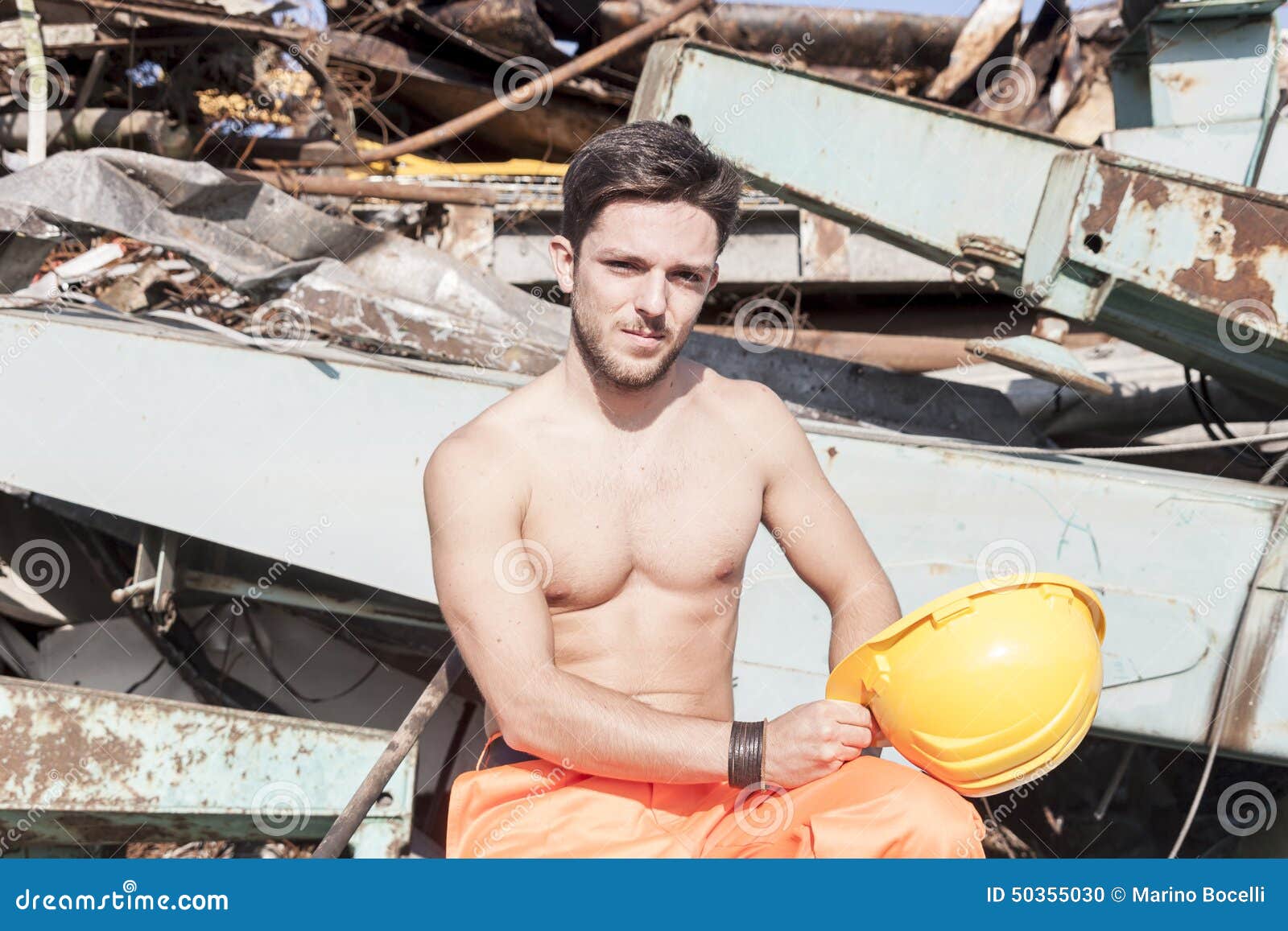 Young worker in a junkyard stock photo. Image of landfill 50355030