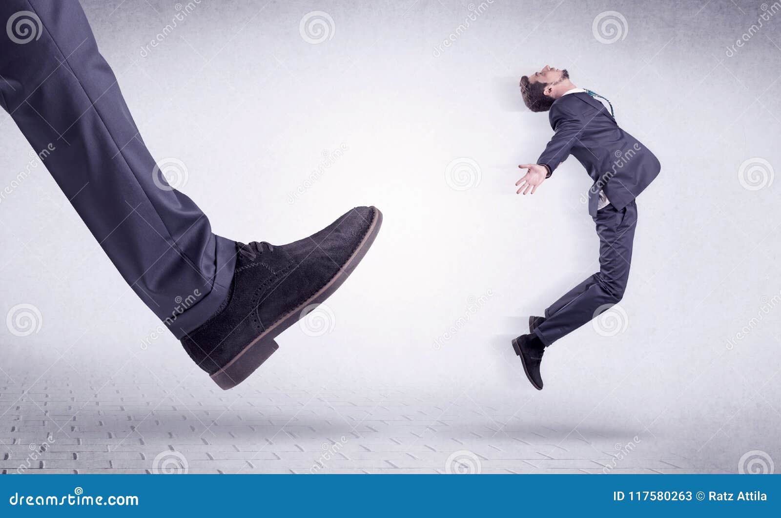 Businessman Being Kicked Out By His Employer Free Image and Photograph  26196001.