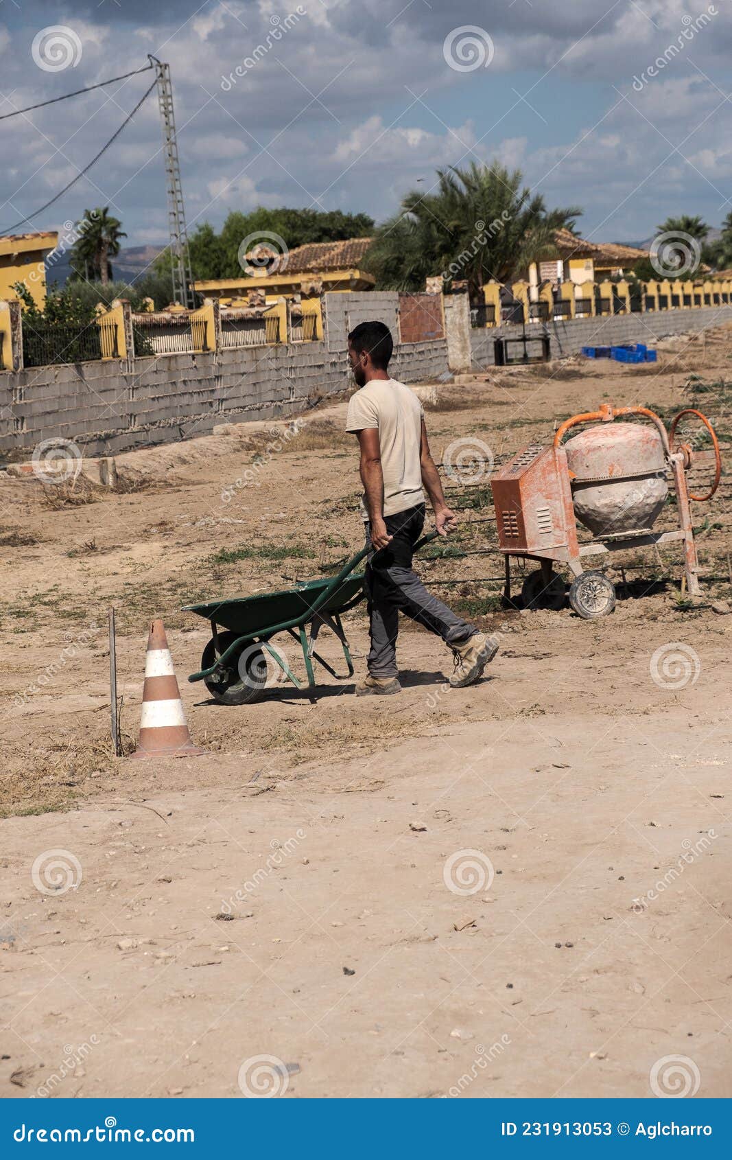 young worker moving cement with a forklift