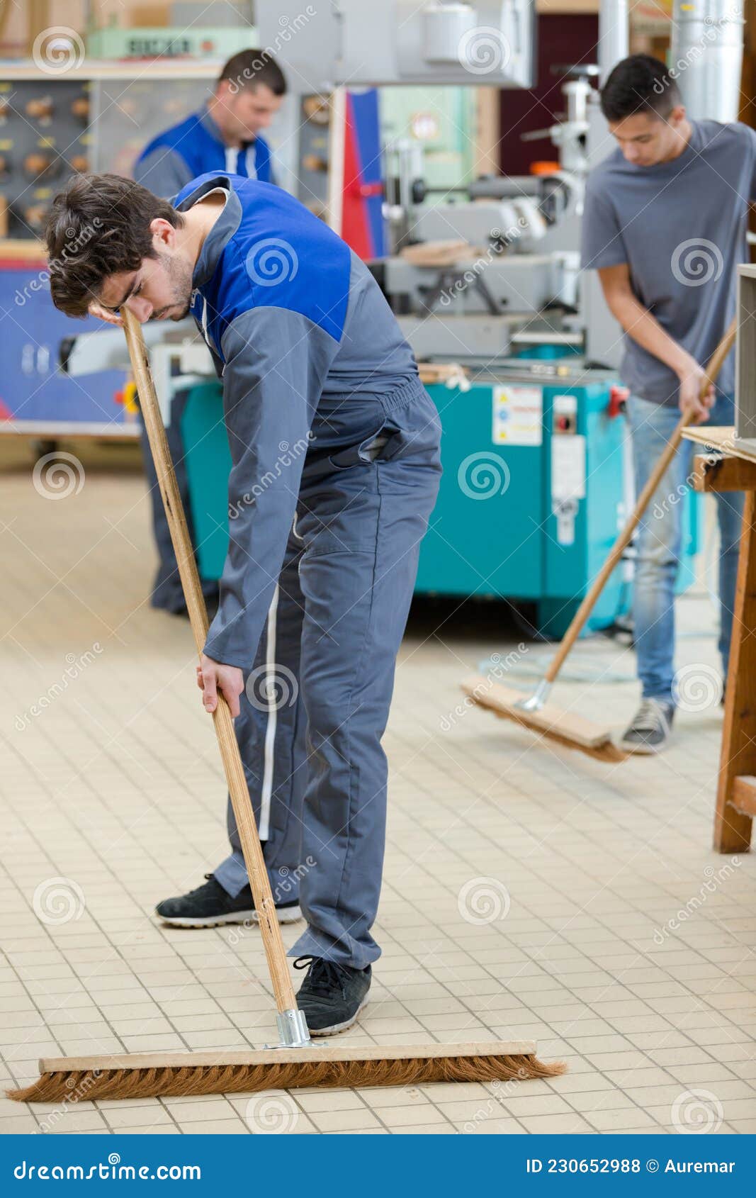 Young Workers Sweeping Up Factory Floor Stock Photo Image of floor