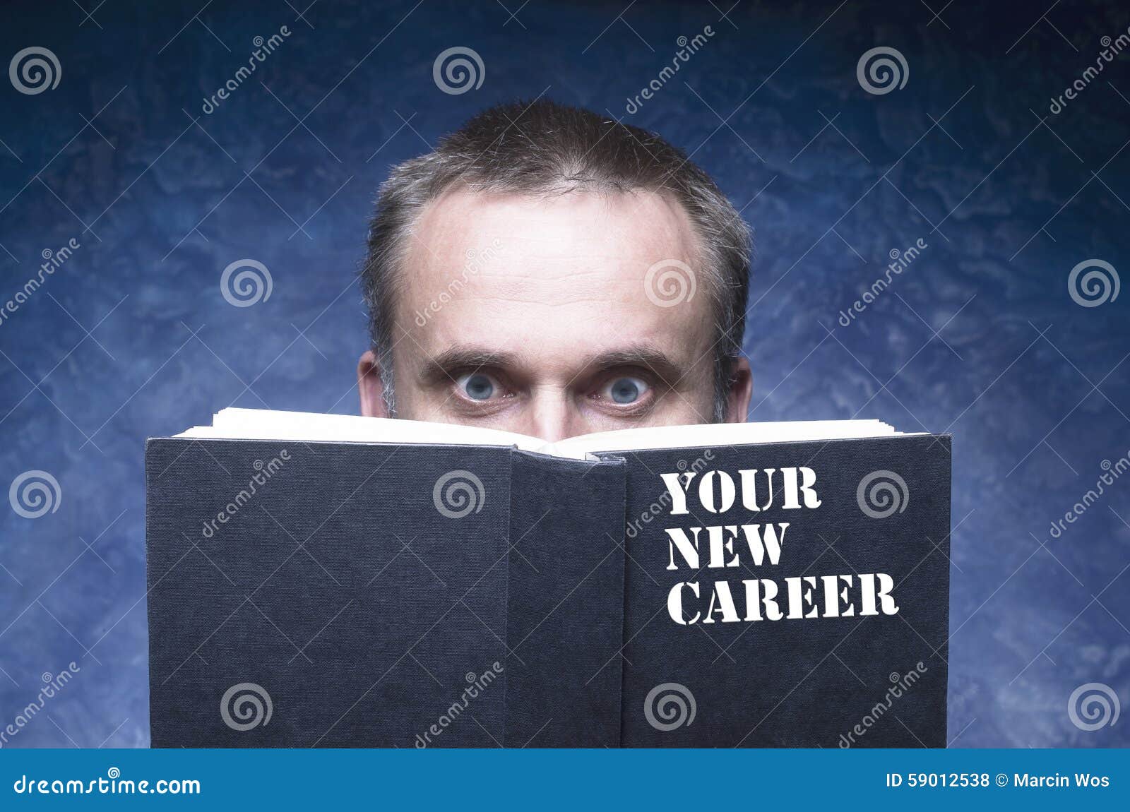Man Being Focused On Light And Handy Ebook Reader, Holding ...