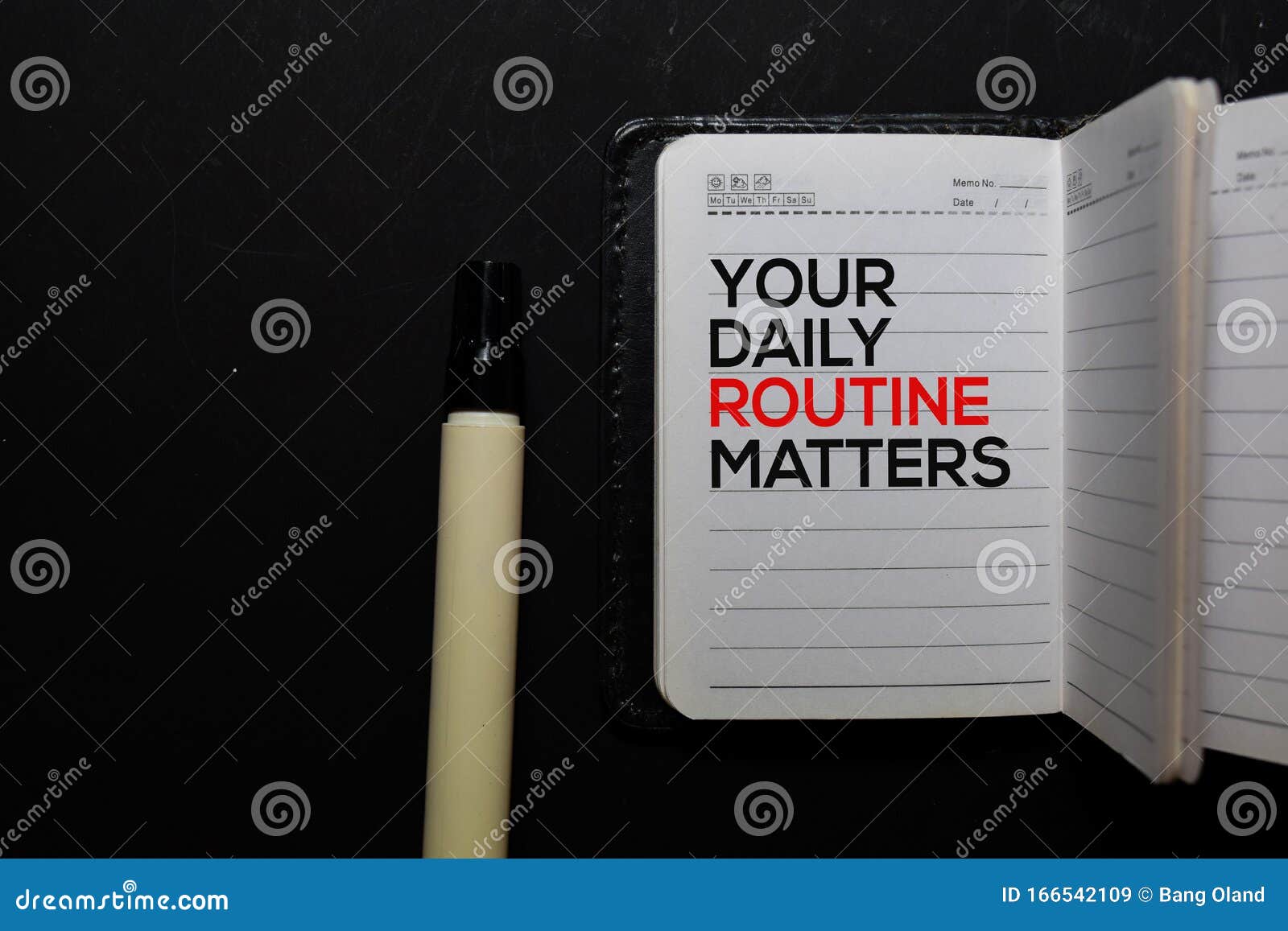 your daily routine matters. write on a book  on office desk