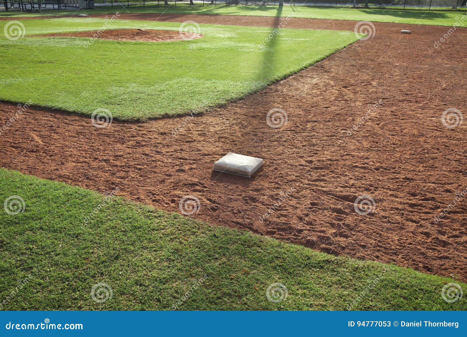 Youth Baseball Infield from First Base Side in Morning Light Stock