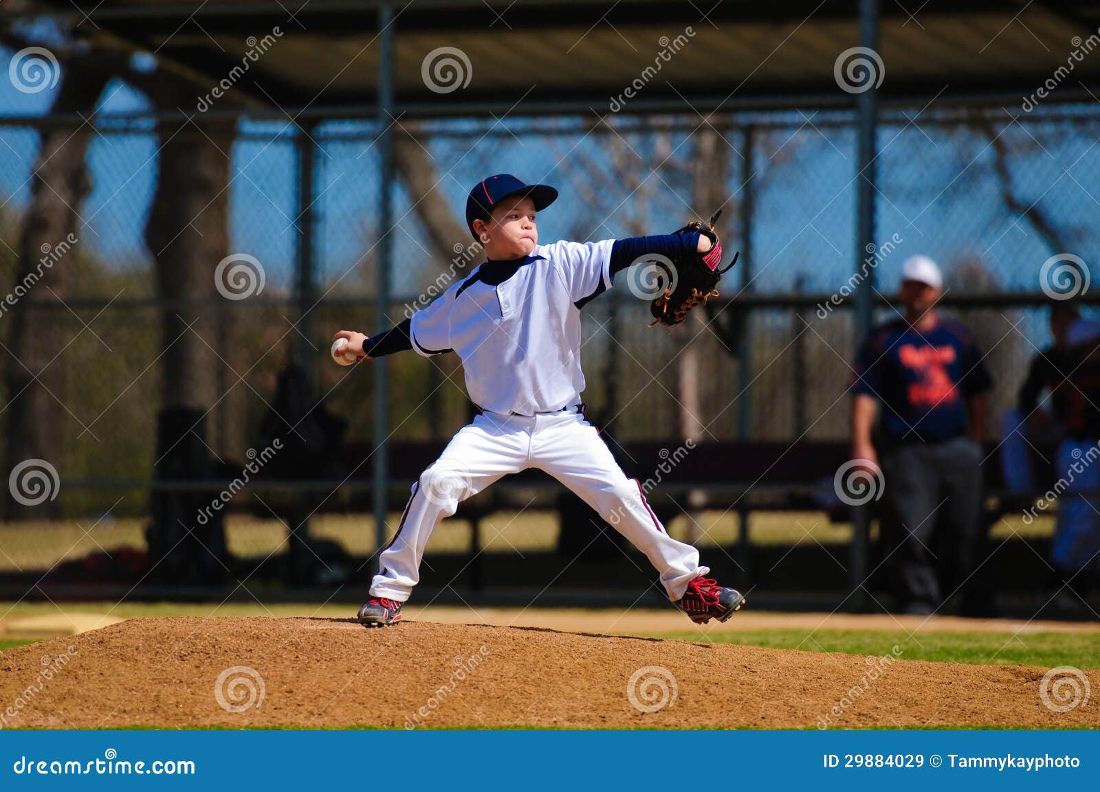 youth baseball pitcher in wind up