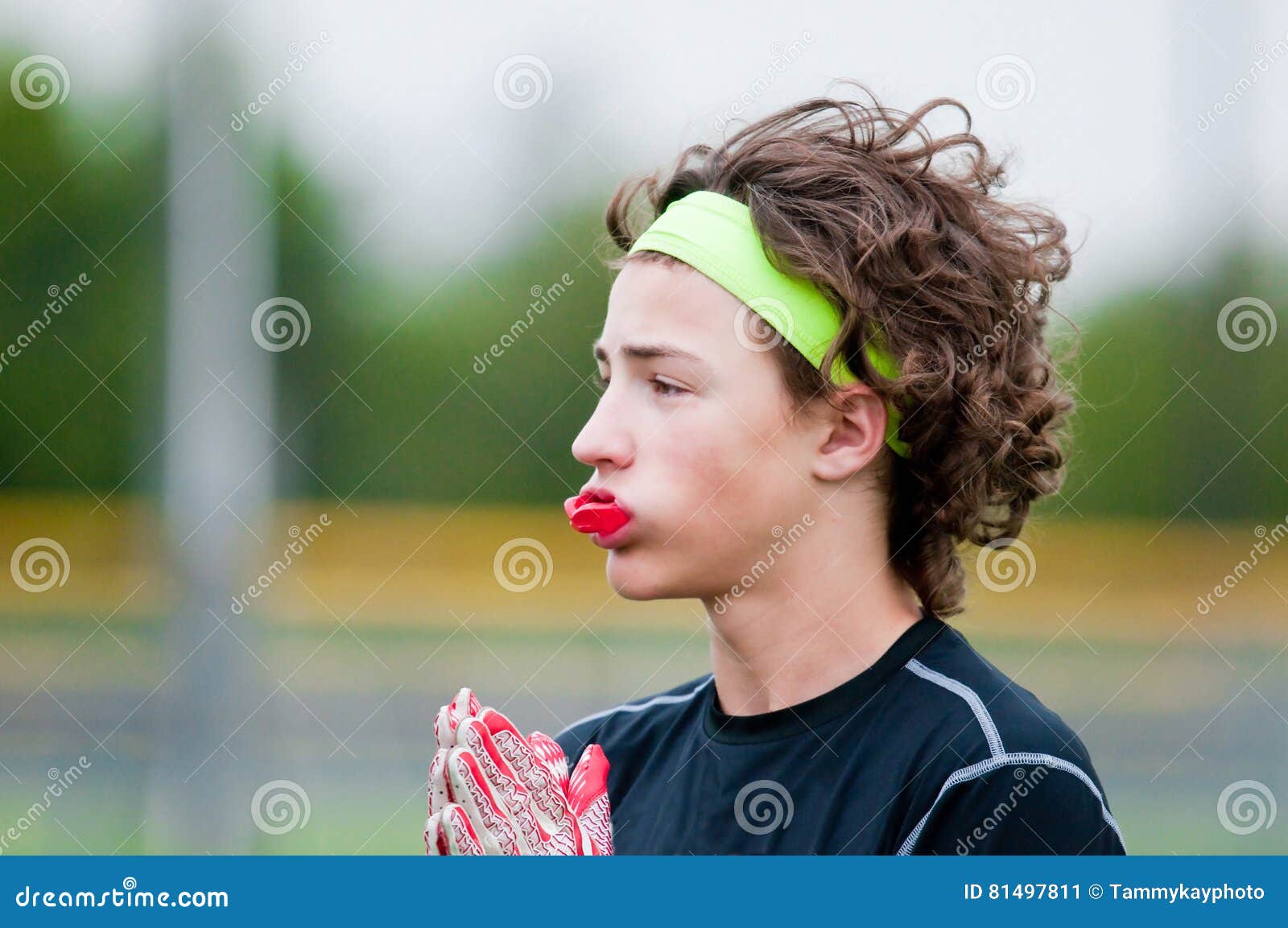 Youth Football Boy with Long Hair Stock Image - Image of long, sport:  81497811