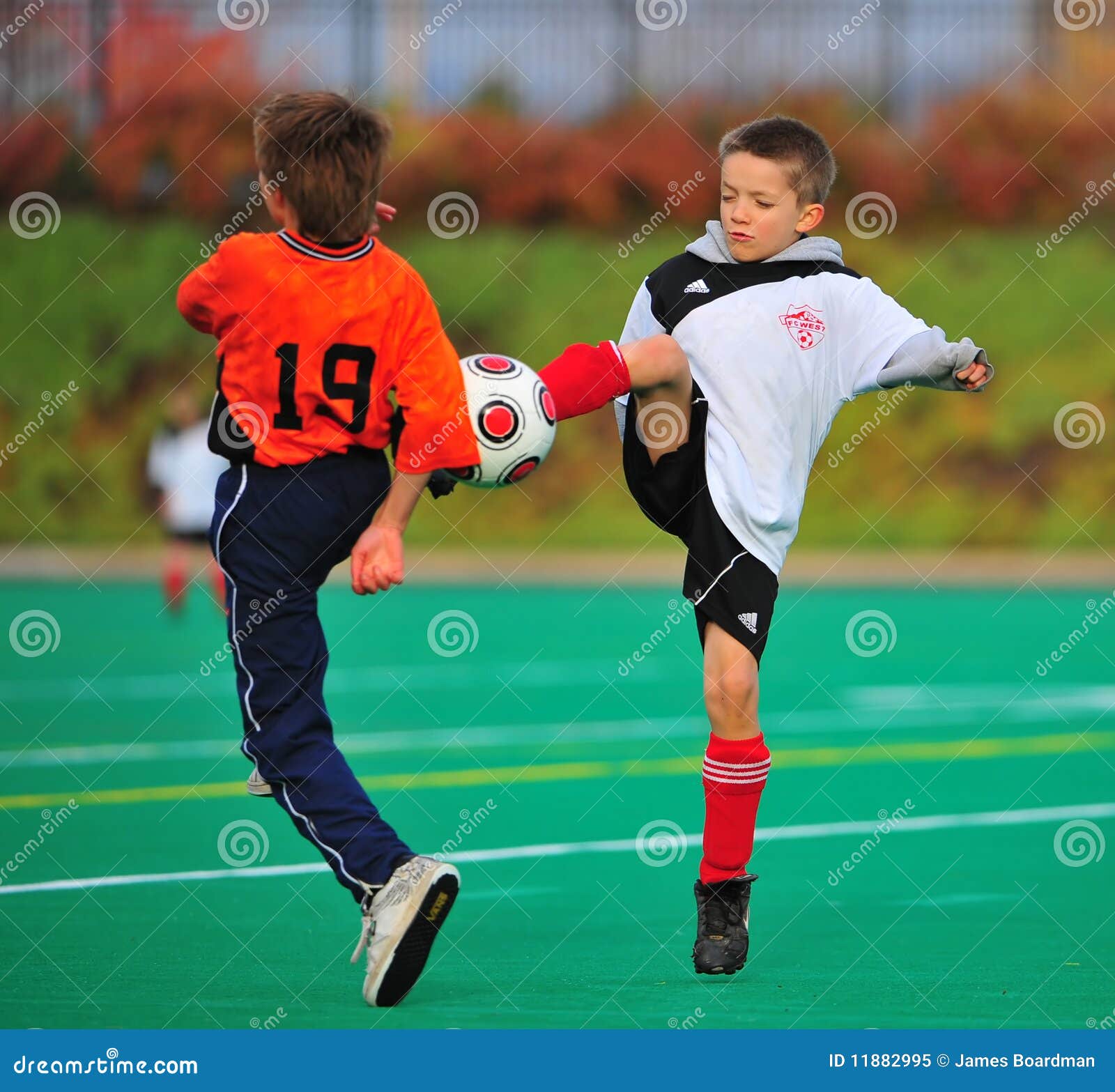 Youth soccer ball kick editorial image. Image of boys 11882995