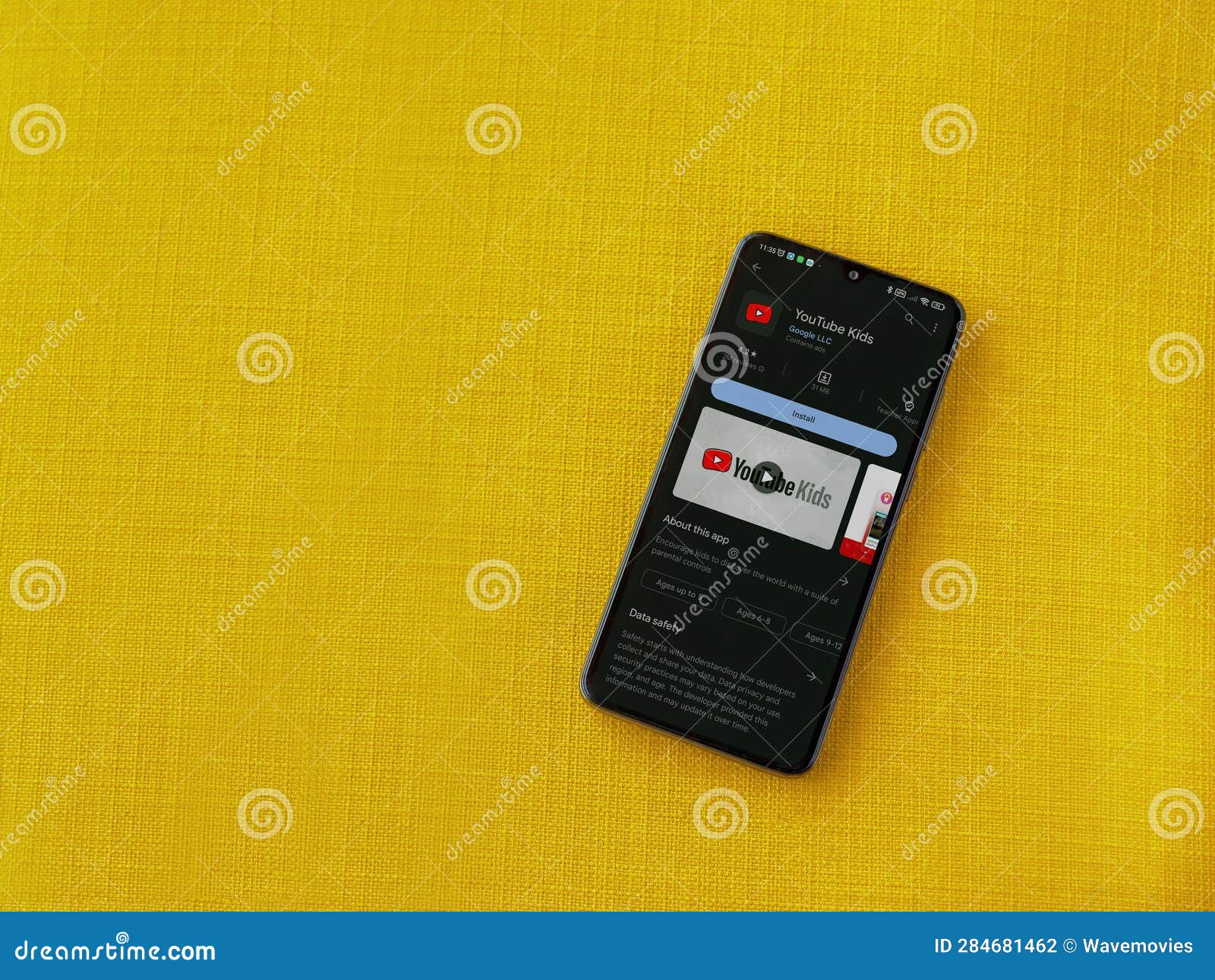 YouTube Kids App Play Store Page on Smartphone on a Yellow Fabric ...