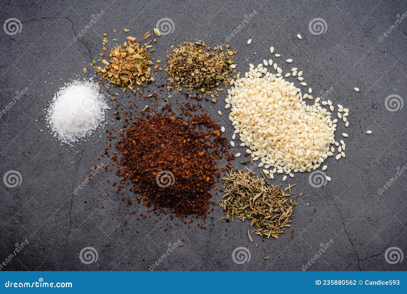Za`atar Substitute Spice Blend Ingredients on a Dark Background Stock
