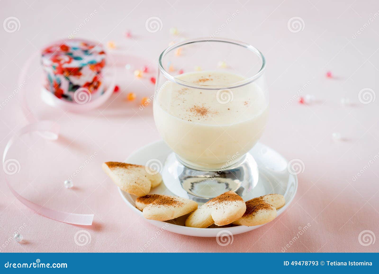 Zabaione, Italian dessert made of egg yolks, sugar, and Marsala wine served with heart-shaped cookies