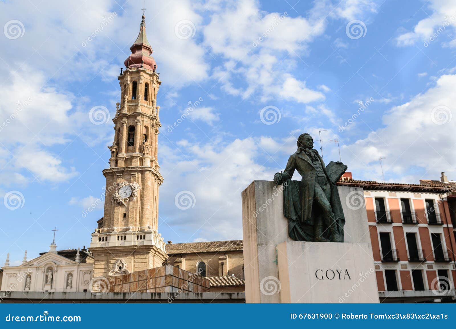 zaragoza, spain, statue of francisco de goya with the tower of the savior cathedral