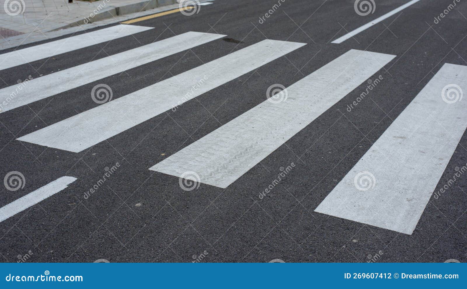 zebra crossing painted on the asphalt of a street