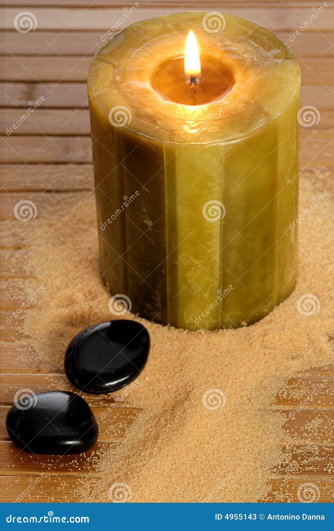 Zen candle and black stone stock image. Image of pebble 4955143