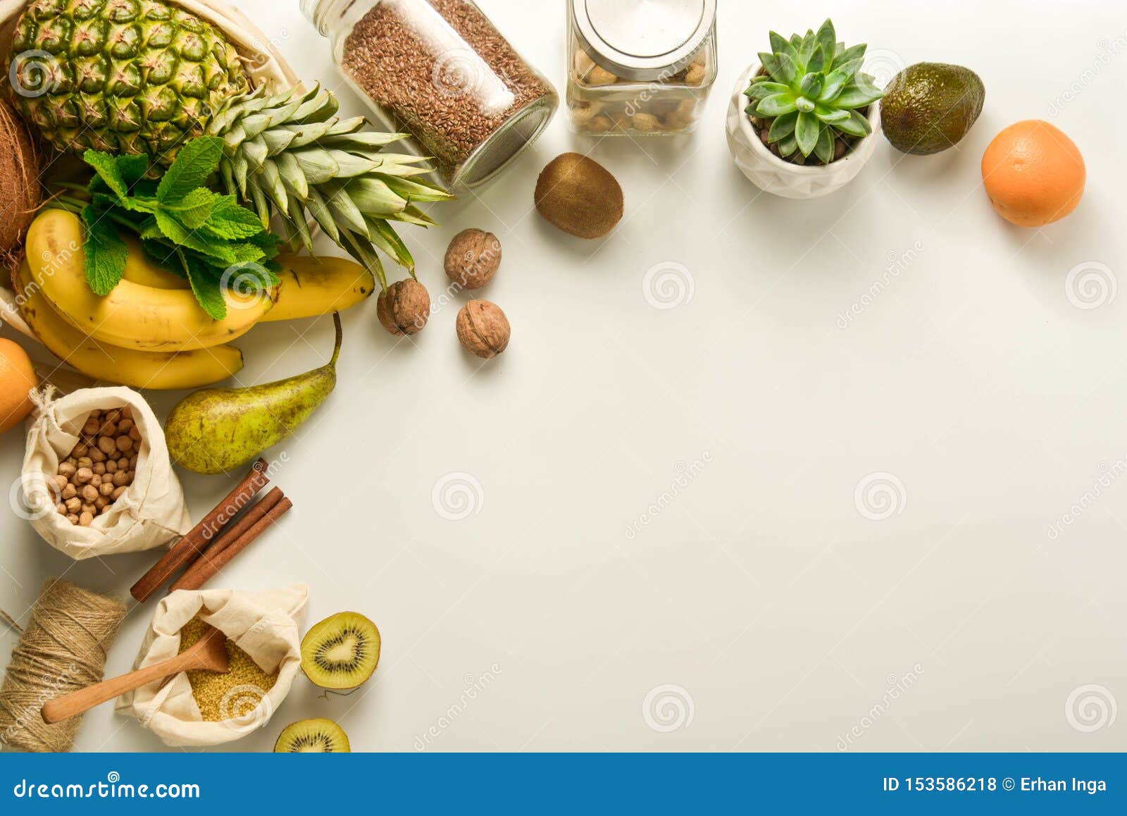 zero waste concept frame. food storage. fruits and cereals in eco textile bags, glass jars with cereals, white background. copy