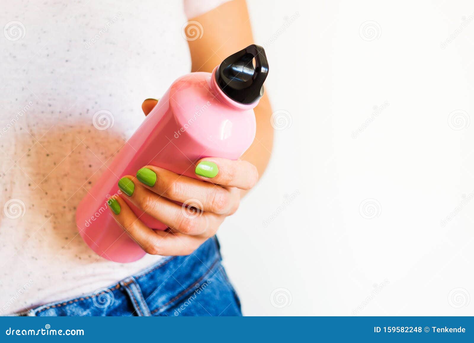 woman holding reusable water bottle