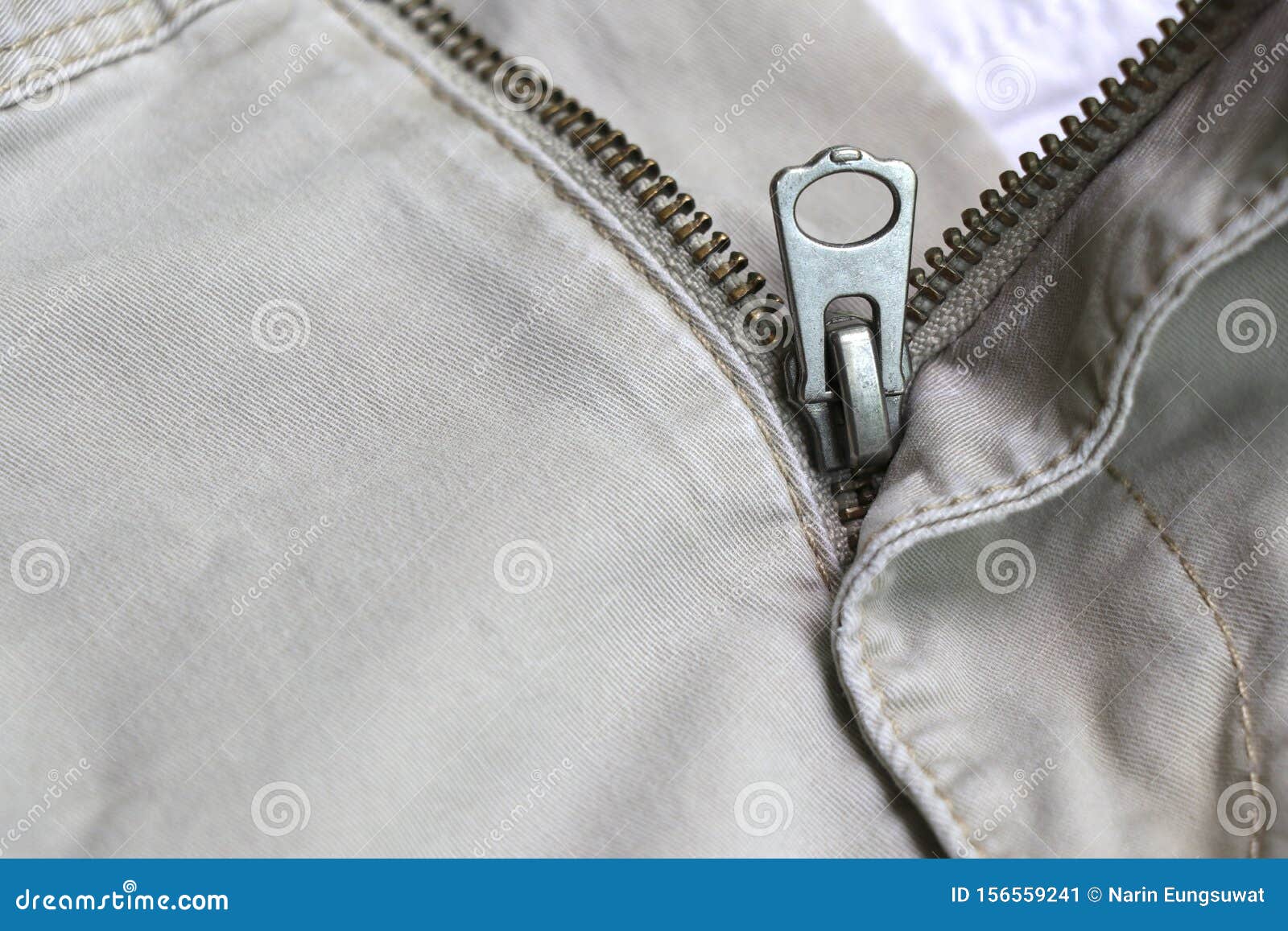 The Zipper of the Pants that Opened. Metal Zipper of Cream Pants Stock ...