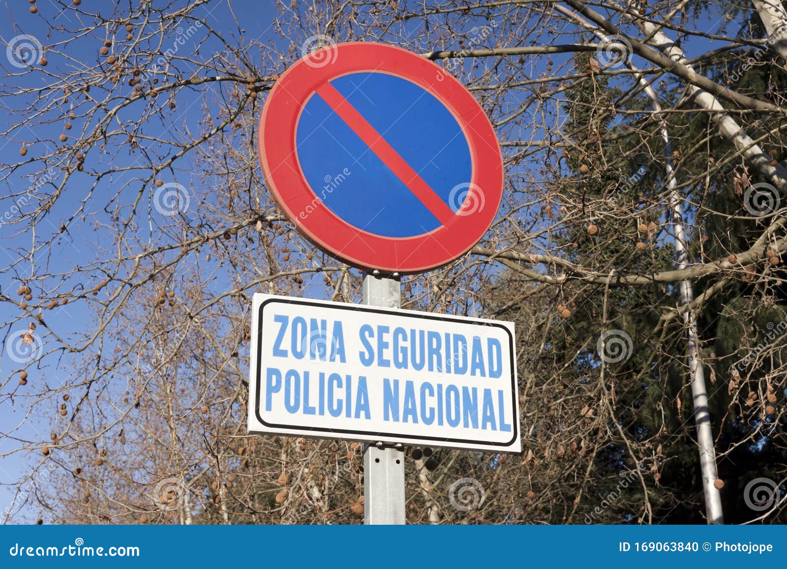zona seguridad, policia nacional no parking sign. security zone, national police in spanish