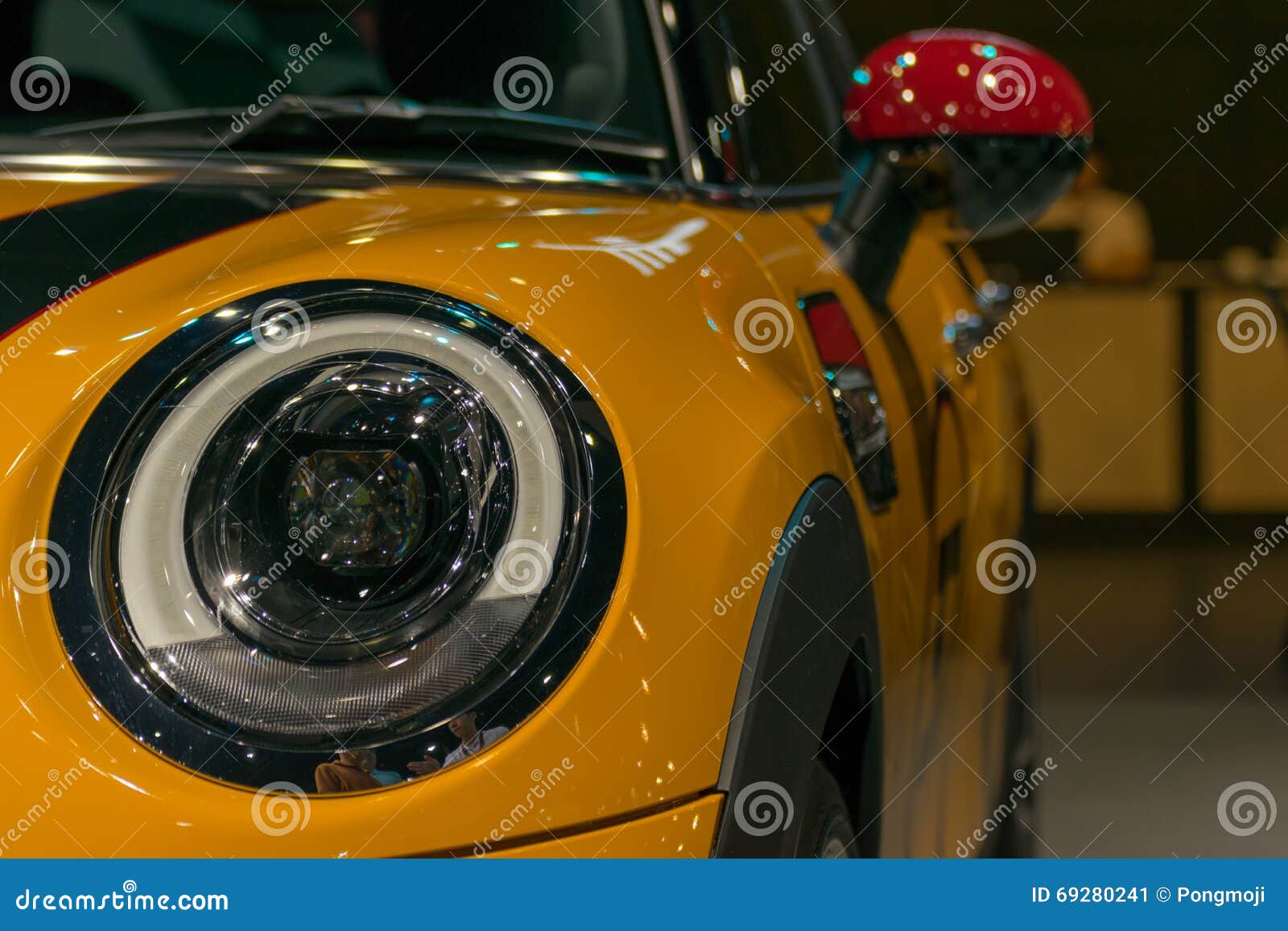 Zoom sports car headlight in Car show event. Zoom at sports car headlight in Car show event at Bangkok, Thailand. This a open event no need property release and press credentials required.