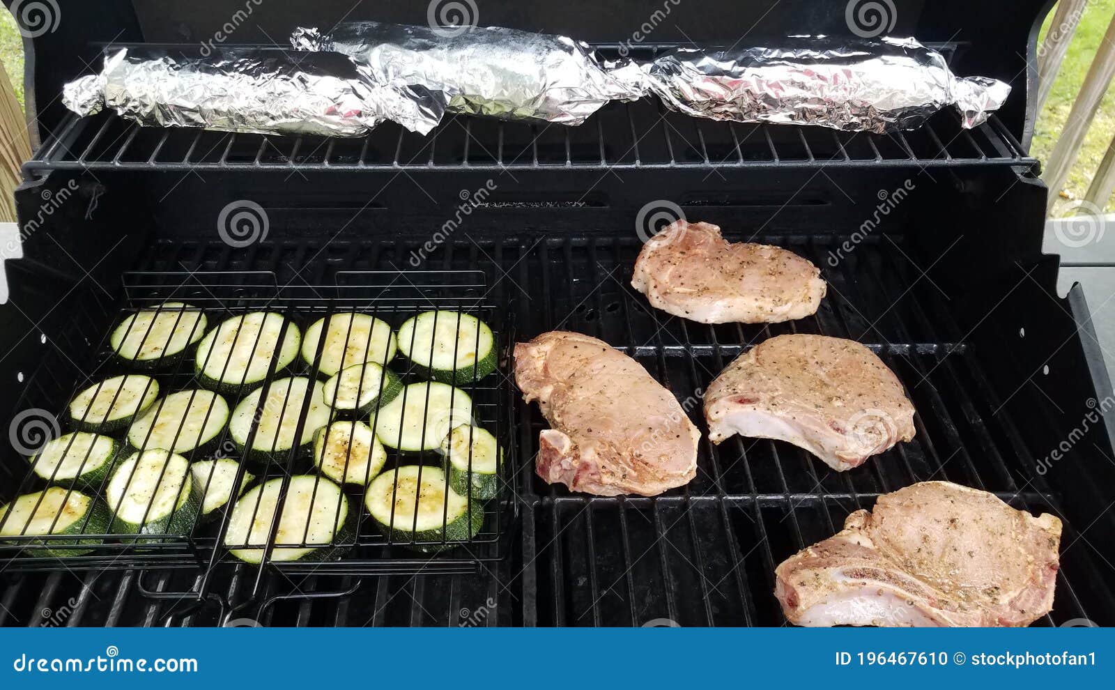 Zucchini And Pork Chops On Barbecue Grill With Corn Stock Photo Image Of Grill Grilling 196467610
