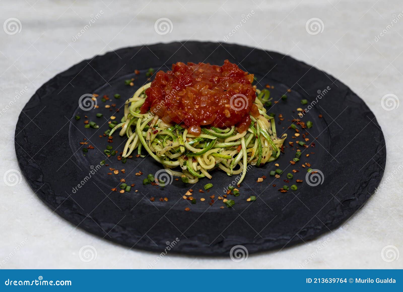 Zucchini Spaghetti with Dehydrated Pepperoni Pepper and Red Sauce Stock