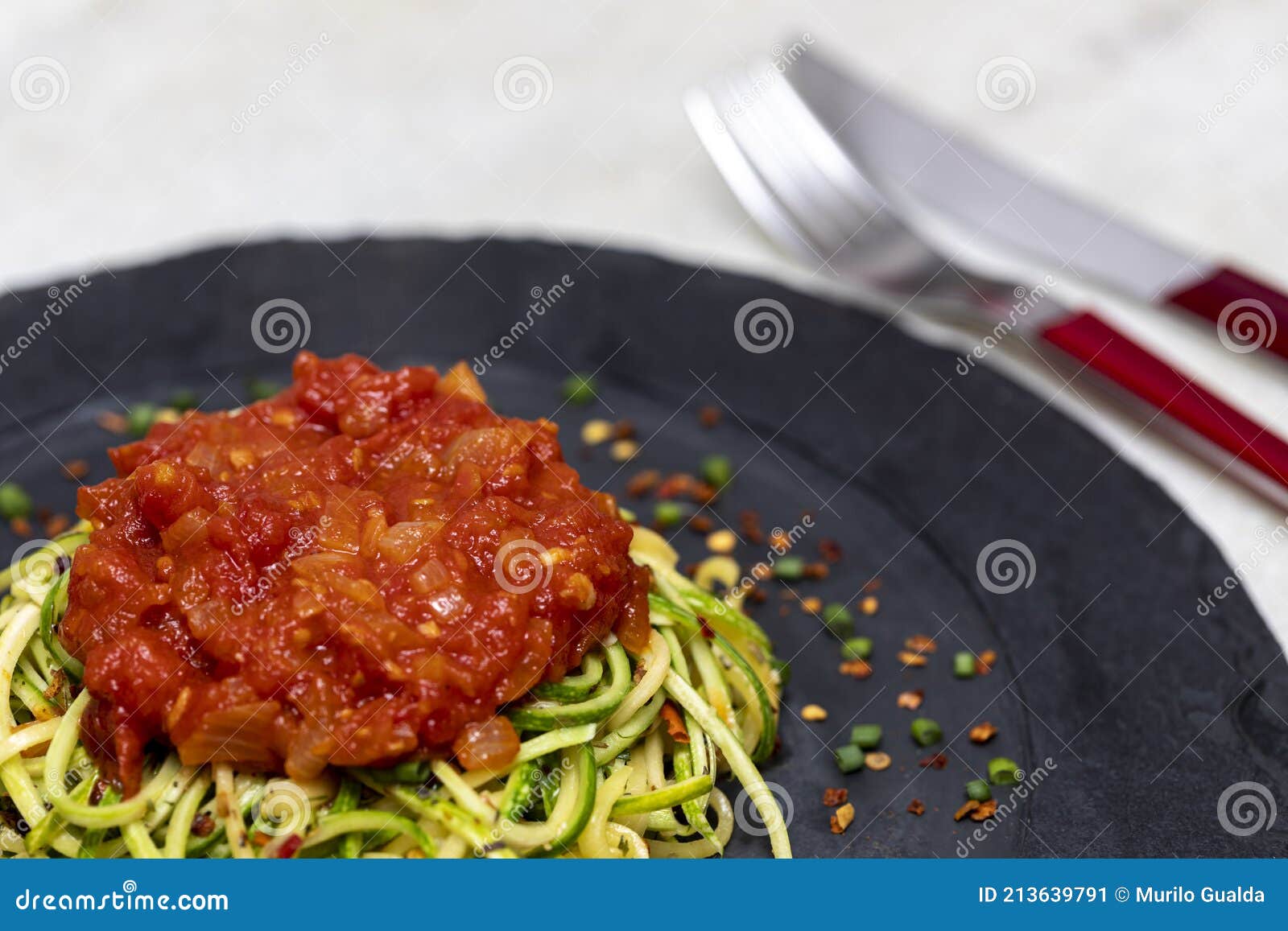 Zucchini Spaghetti with Dehydrated Pepperoni Pepper and Red Sauce Stock