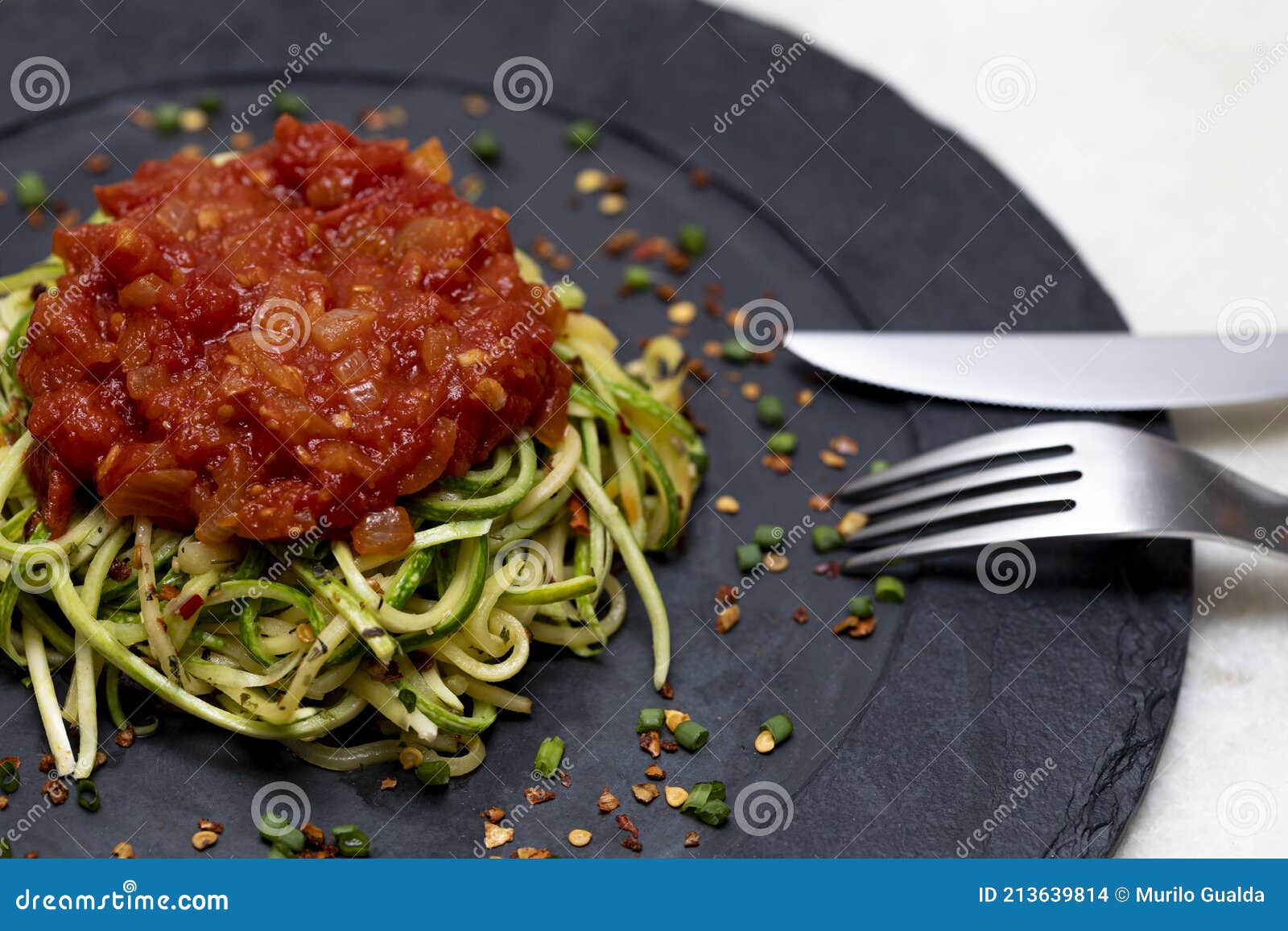 Zucchini Spaghetti with Dehydrated Pepperoni Pepper and Red Sauce Stock