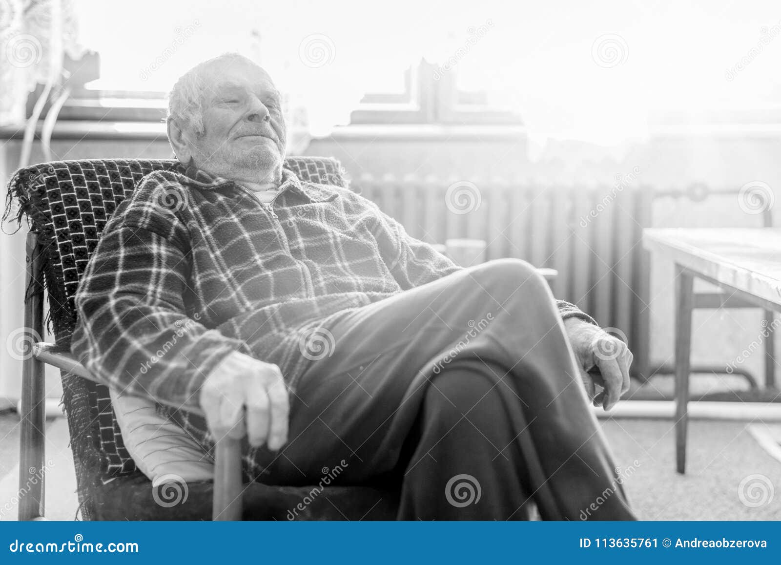 Black old man sitting