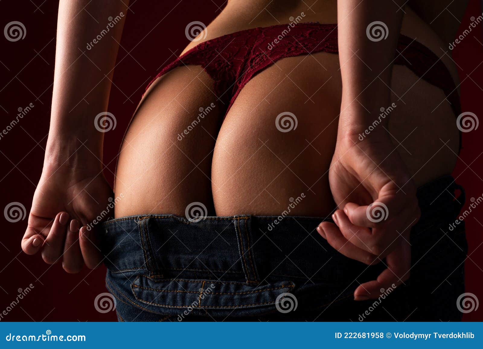 Taking off her panties. Close-up of beautiful female legs holding panties Taking off her panties. Close-up of beautiful female legs holding panties