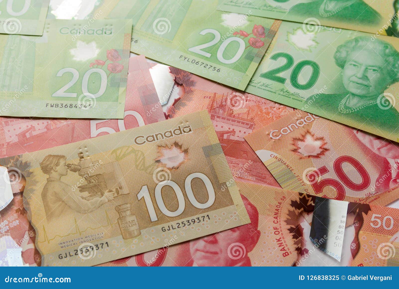 加拿大元货币/票据 编辑类库存照片. 图片 包括有 一百, 洗涤, 投资, 节省额, 票据, 货币, 编号 - 69478153