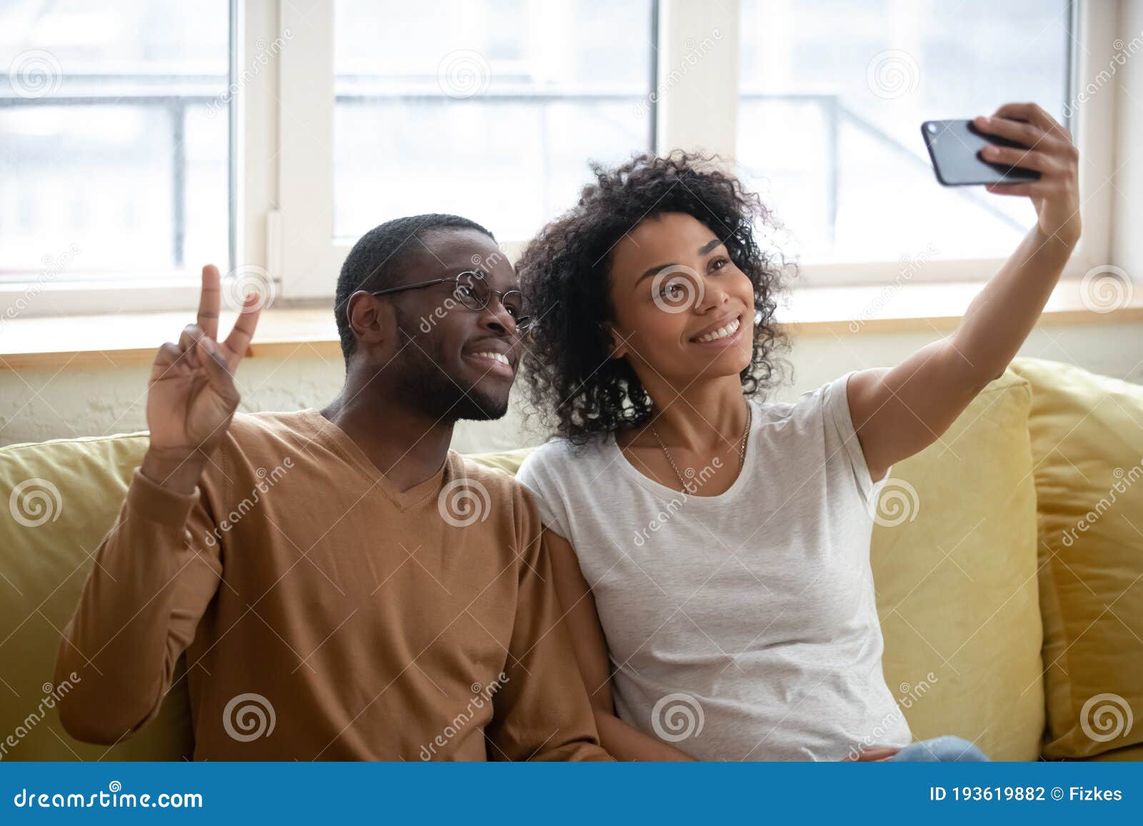 Happy Together. Family Portrait of Smiling Black Couple Hugging, Yellow ...